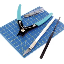 Accessories<9pc Plastic Modelling Tool Set - Miniature Marvels: Airplane Models & Painted Dice